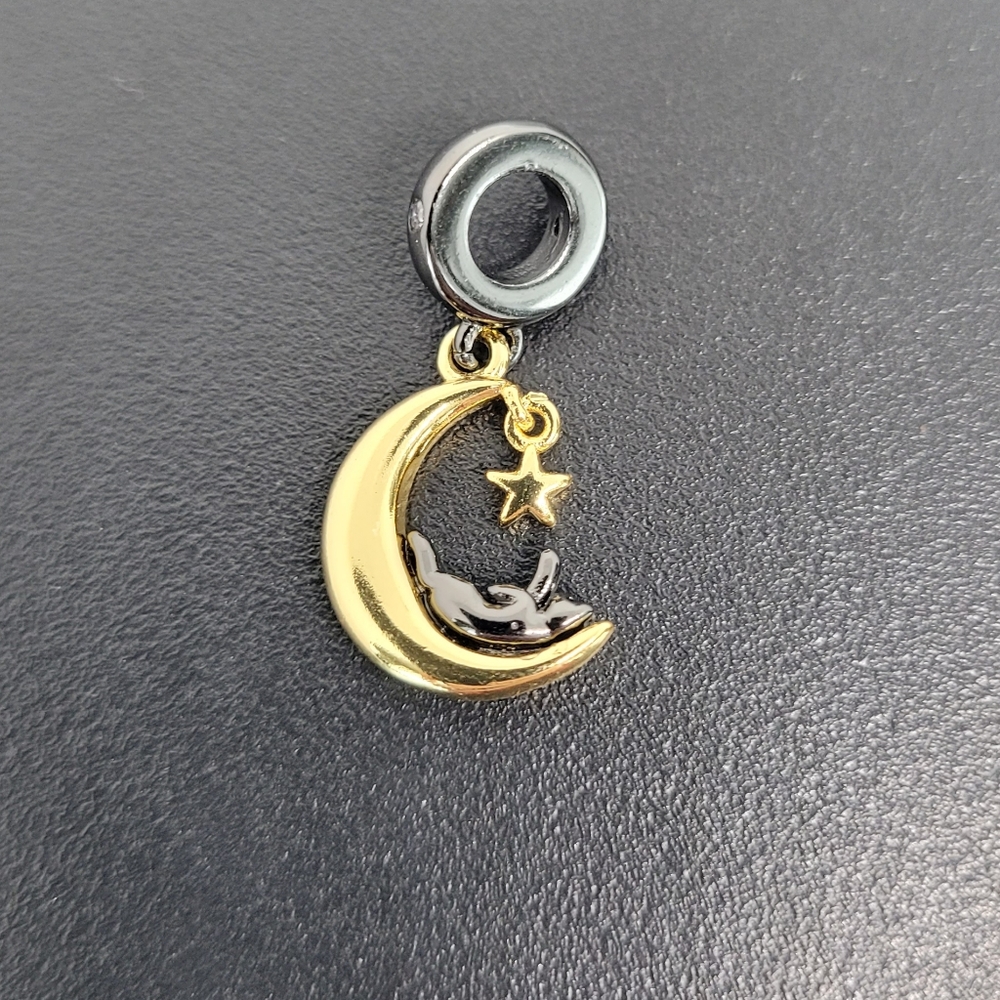 Silver-plated black cat on golden Crescent moon charm with dangling star